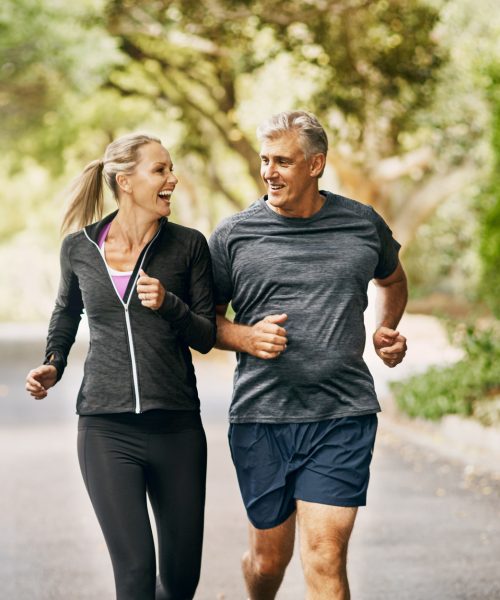 Shot of a mature couple out jogging on a sunny day